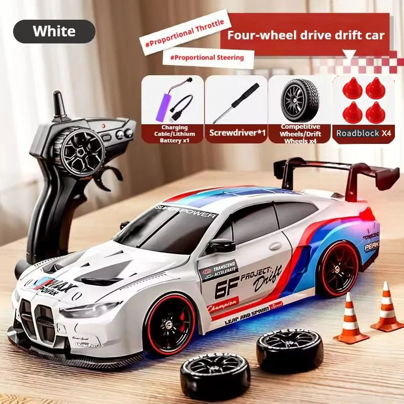 White 4WD RC drift car with interchangeable wheels and remote control